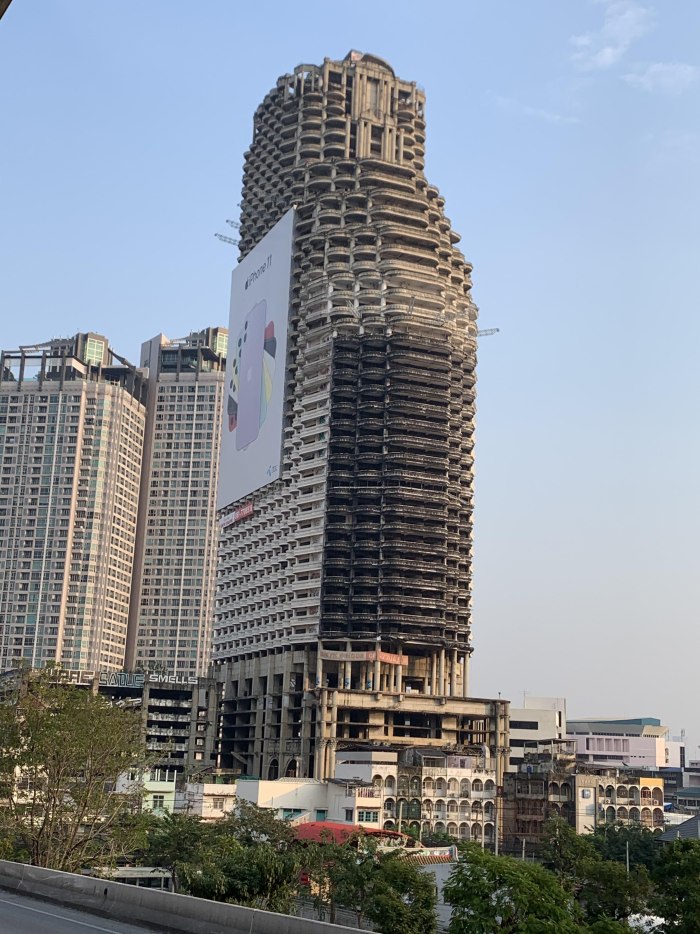 Giant Apple advertising for iphone on Sathorn unique Tower an Unfinished